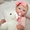 Boneca Bebê Reborn realista com macacão rosa Brastoy