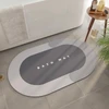 Tapete oval absorvente e antiderrapante para banheiro 38x58