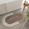 Tapete oval absorvente e antiderrapante para banheiro 38x58
