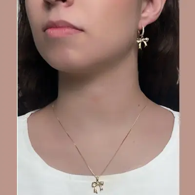 CONJUNTO LAÇO CRAVEJADO EM ZIRCÔNIA CRISTAL BANHO OURO 18K